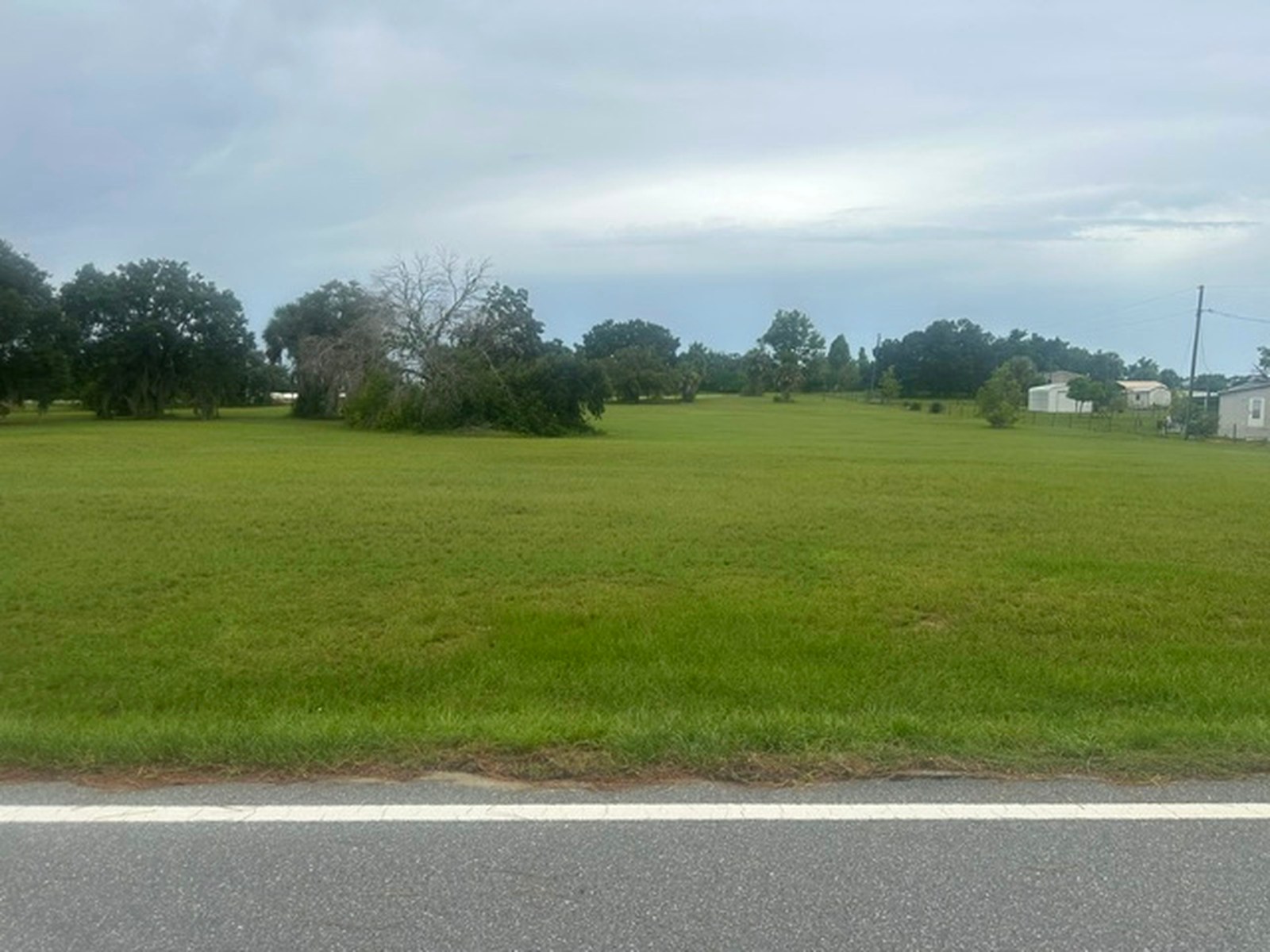 Street-level view of the cleared parcel from Olsen Road